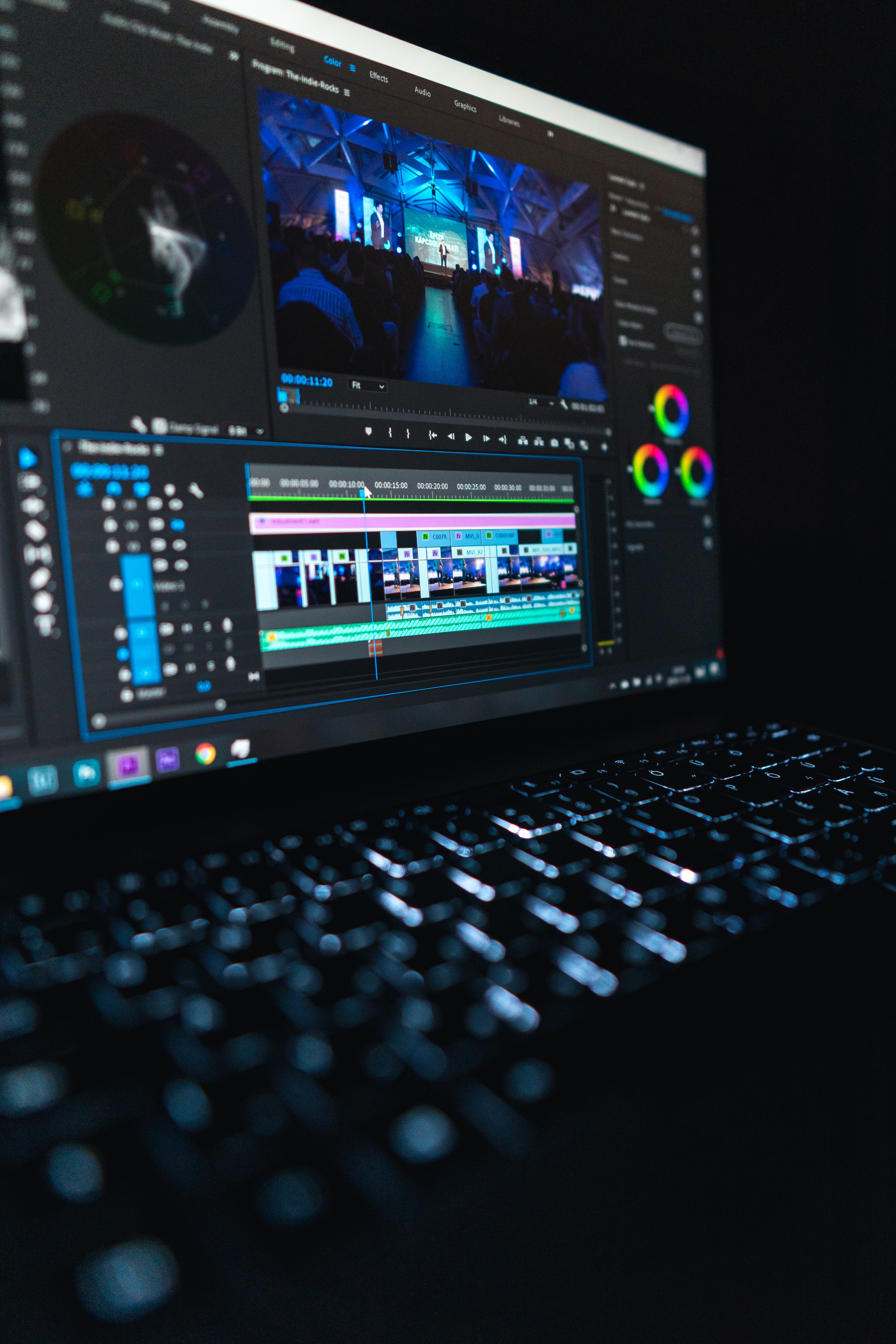 Black laptop computer showing Premier Pro workflow during video editing